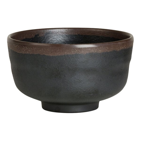 A black melamine bowl with brown edges.