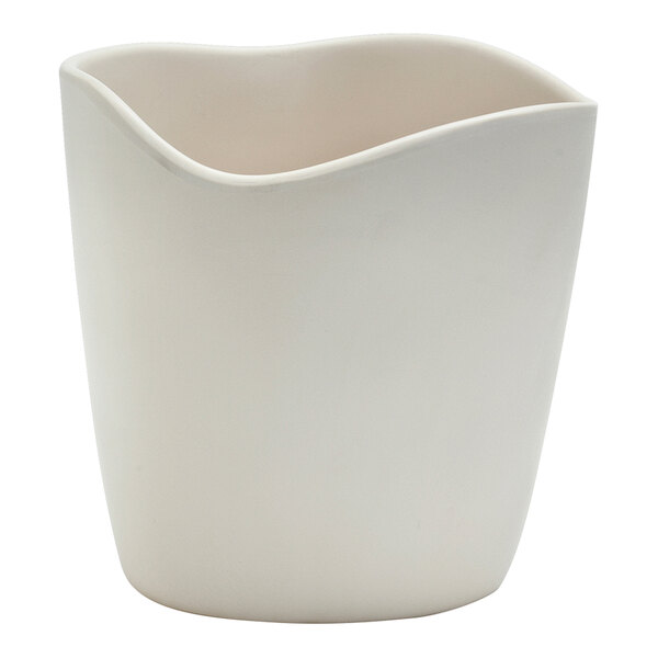 A white melamine small dressing crock with a curved edge.