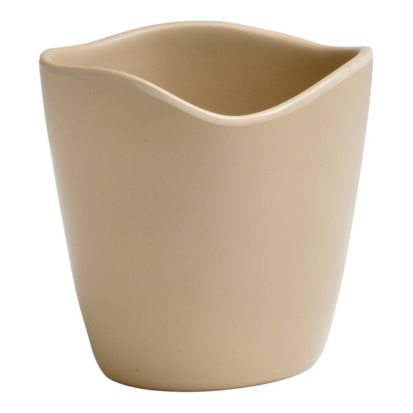 A cream colored melamine dressing crock with a curved edge.