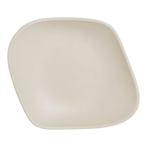 A white melamine serving bowl with a curved edge.