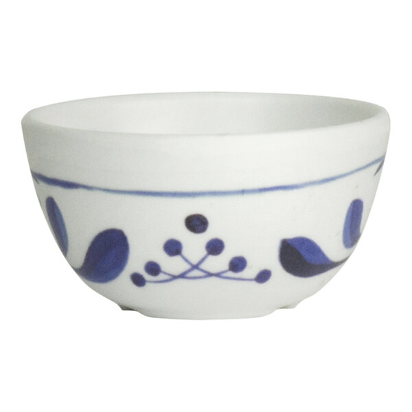 A white Delfin Viva melamine ramekin with blue designs.