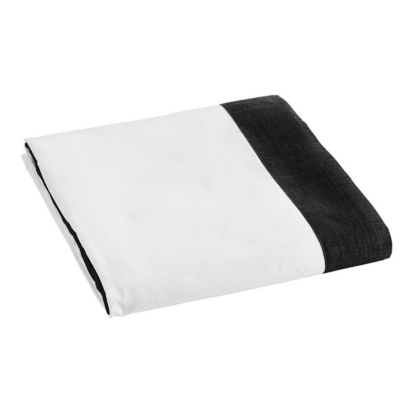 A white and black woven faux linen box spring cover.