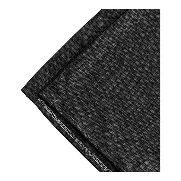 A black woven faux linen box spring cover with a white border.