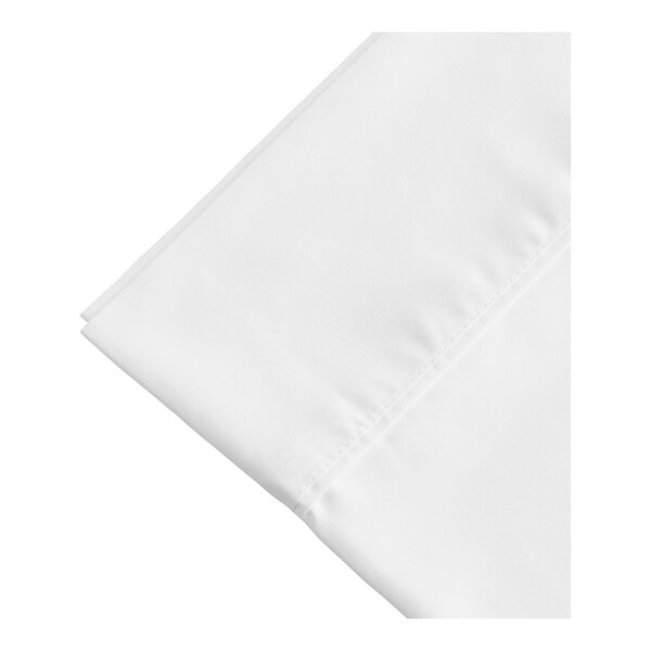 A white folded Berkshire Hospitality SuiteDream pillowcase on a white surface.