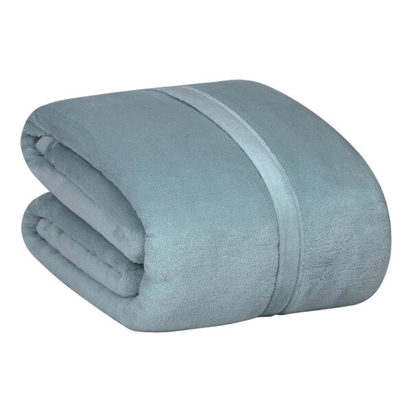 A folded blue Berkshire Hospitality Serasoft+ king size blanket with a folded edge.