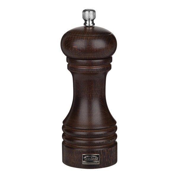 A Trudeau chocolate beechwood salt mill with a silver top.