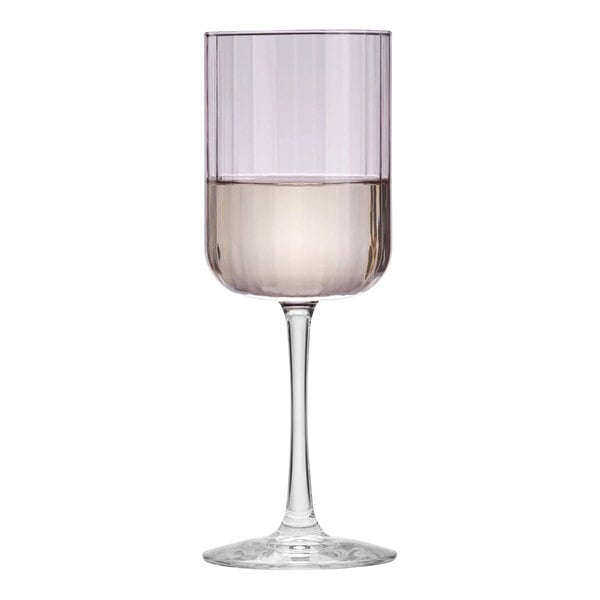 A Libbey wine glass with a pink rim filled with a drink.