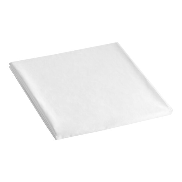 A folded white Berkshire Hospitality king size fitted sheet on a white surface.