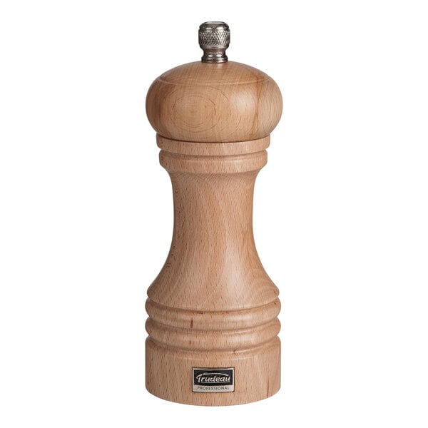 A Trudeau natural beechwood pepper mill with a metal top.