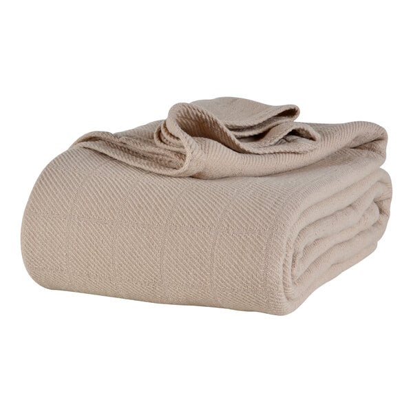 A folded natural beige Berkshire Hospitality AllSoft King Size cotton blanket.