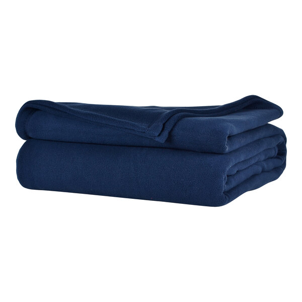 A stack of folded navy blue Berkshire Hospitality Microfleece blankets on a white surface.