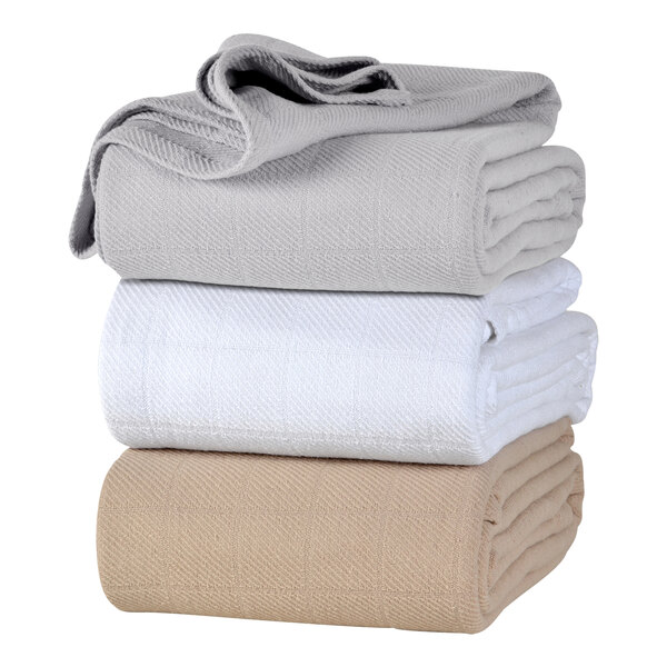 A stack of Berkshire Hospitality twin size gray cotton blankets.