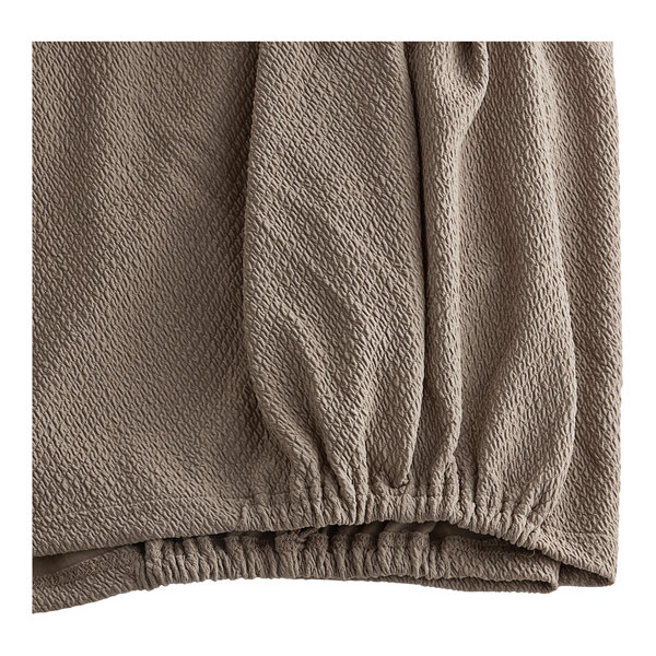 A close up of a brown fabric with a diamond pattern.