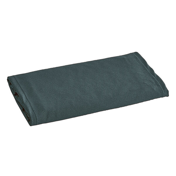 A folded dark green Berkshire Hospitality Helix box spring cover on a white background.