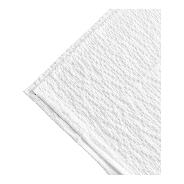 A close up of a white Berkshire Hospitality classic seersucker top sheet.