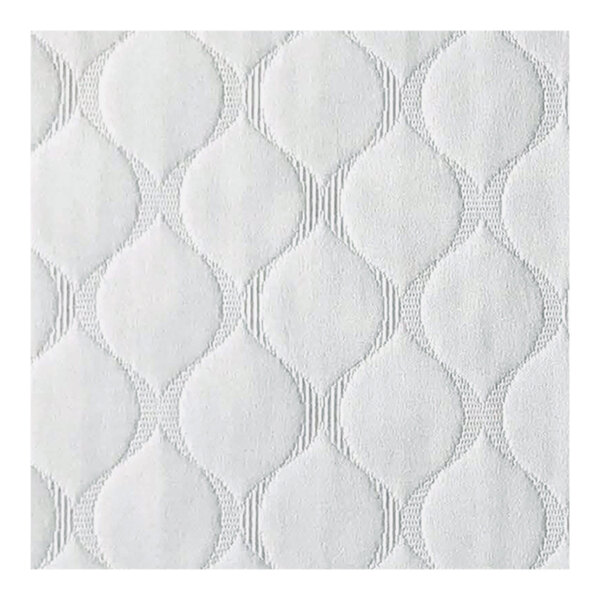 A white coverlet with a pattern of ogee circles.