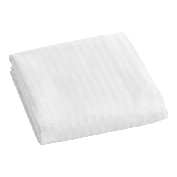 A folded white Berkshire Hospitality king size top sheet.