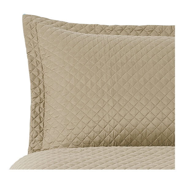 A close up of a Berkshire Hospitality truffle diamond quilt pillow sham.