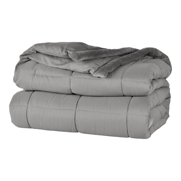 A stack of Berkshire Hospitality smoke grey blankets.