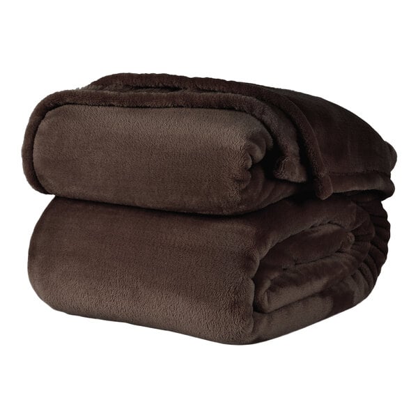 A stack of chocolate brown Berkshire Hospitality VelvetLoft twin size blankets.