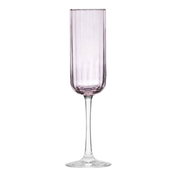 A close up of a Libbey pink flute wine glass with a purple rim.