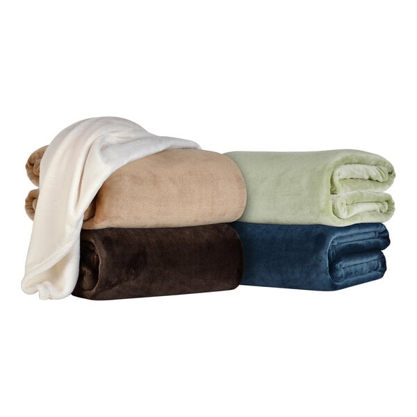 A stack of Berkshire Hospitality Colt king size blankets in different colors on a white background.