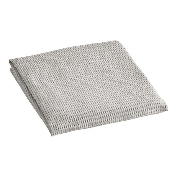 A gray Berkshire Hospitality top sheet with a white jacquard pattern.