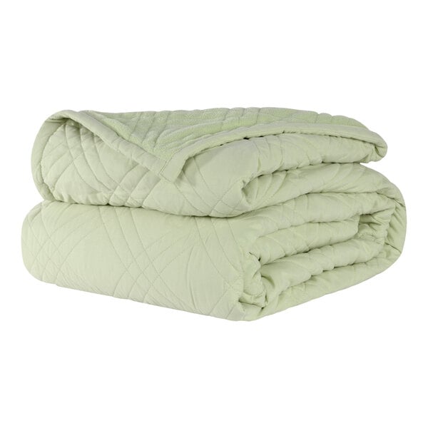 A stack of Berkshire Hospitality CozyCare bedspreads in spa green.