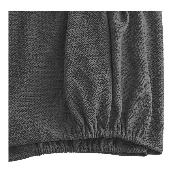 A close-up of a grey knit diamond box spring cover.