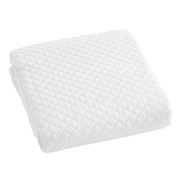 A Berkshire Hospitality white quilted coverlet.