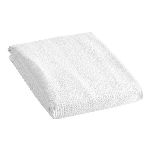 A white folded Berkshire Hospitality seersucker top sheet.