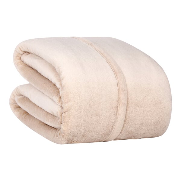 A folded beige Berkshire Hospitality Serasoft+ king size blanket.