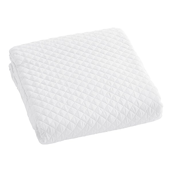 A white quilted Berkshire Hospitality coverlet.