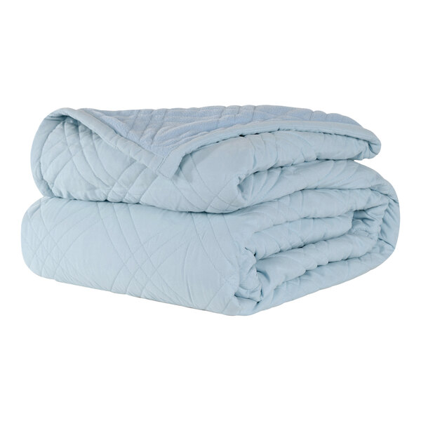 A stack of blue Berkshire Hospitality CozyCare twin size fitted coverlets.