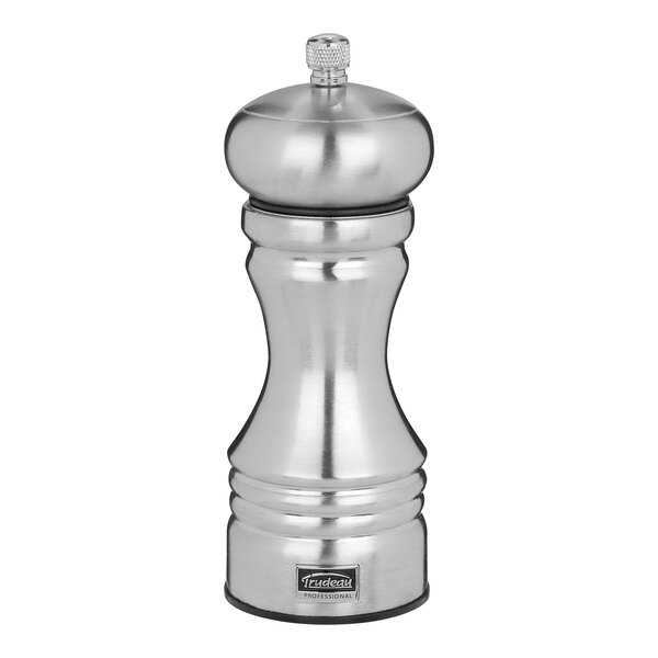 A Trudeau stainless steel pepper mill with a lid.