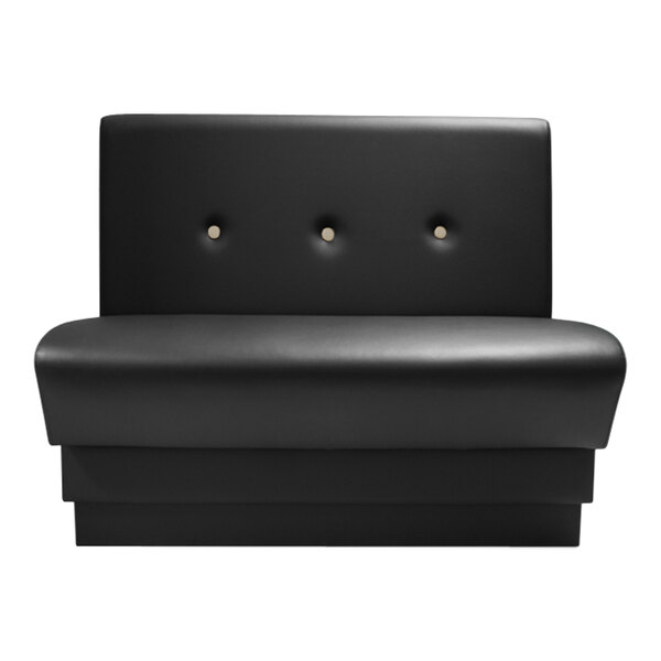 A black leather booth with button tufted single back.