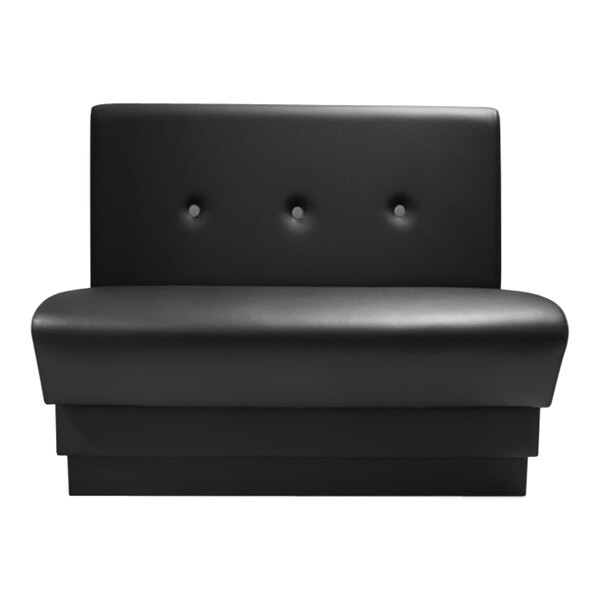 A black leather booth with button tufting on the back.