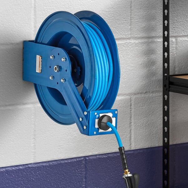 A Regency blue powder-coated steel hose reel attached to a wall.
