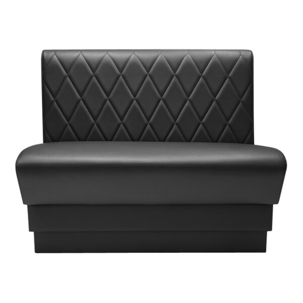 A black leather booth with a diamond tufted square back.