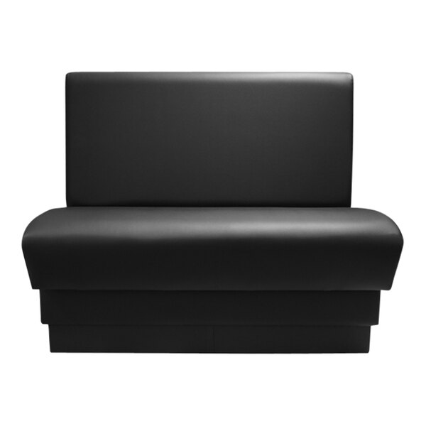A black leather booth with a black seat.