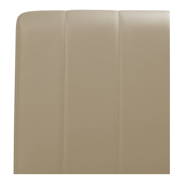 The back of a beige leather booth with a single channel.