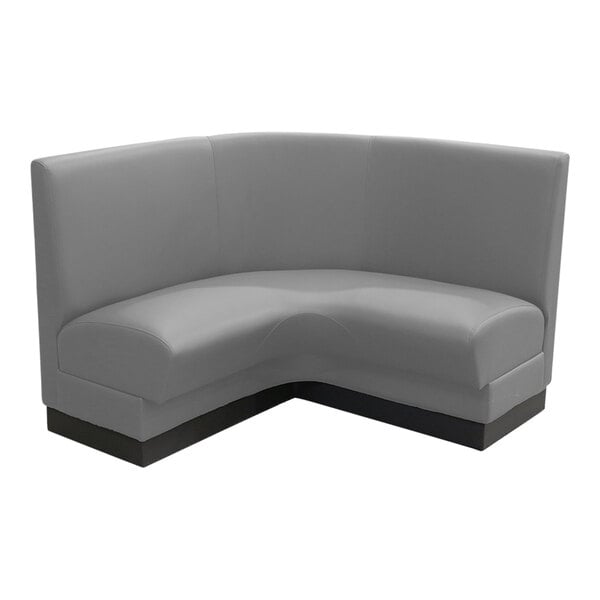 A QA Group graphite corner booth with a curved corner and black legs.