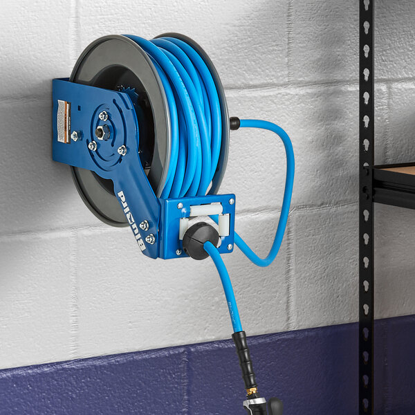 A blue Regency air hose attached to a wall.