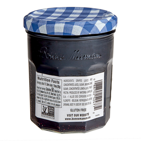 A Bonne Maman Muscat Grape Jelly jar with a blue and white checkered lid.
