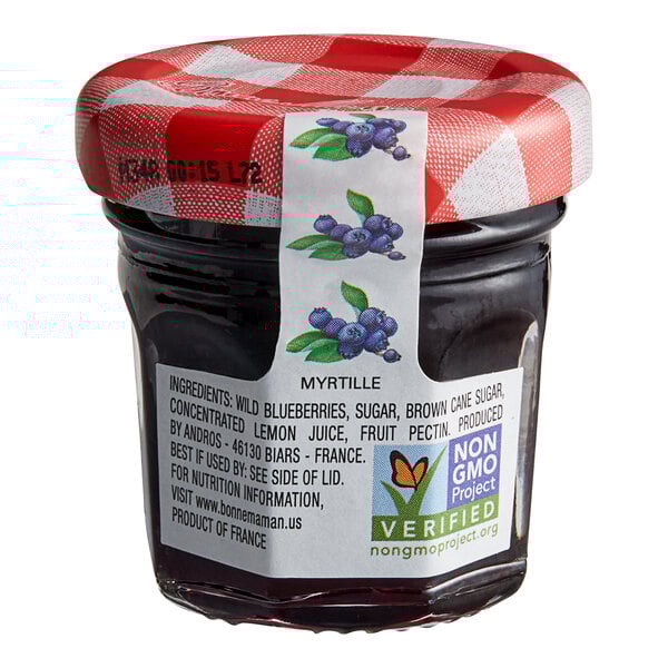 A Bonne Maman mini jar of Wild Blueberry Preserves with a red and white checkered lid and label.