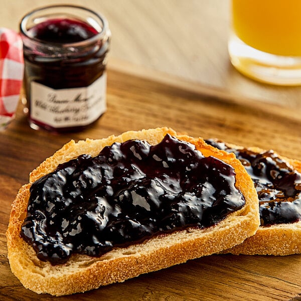 A piece of bread with Bonne Maman Wild Blueberry Preserves on it.