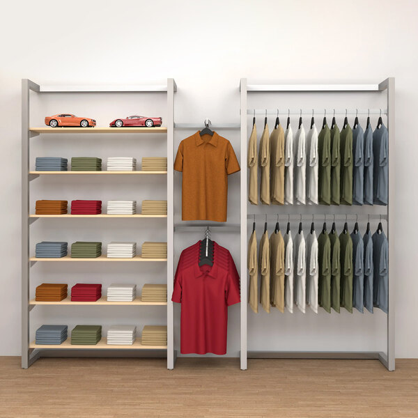 An Econoco wall-mount retail display kit with shelves, hangrails, and a faceout holding shirts.