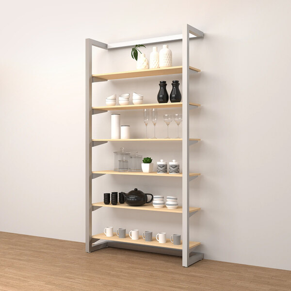 An Econoco wall-mount display shelf with different objects on it.