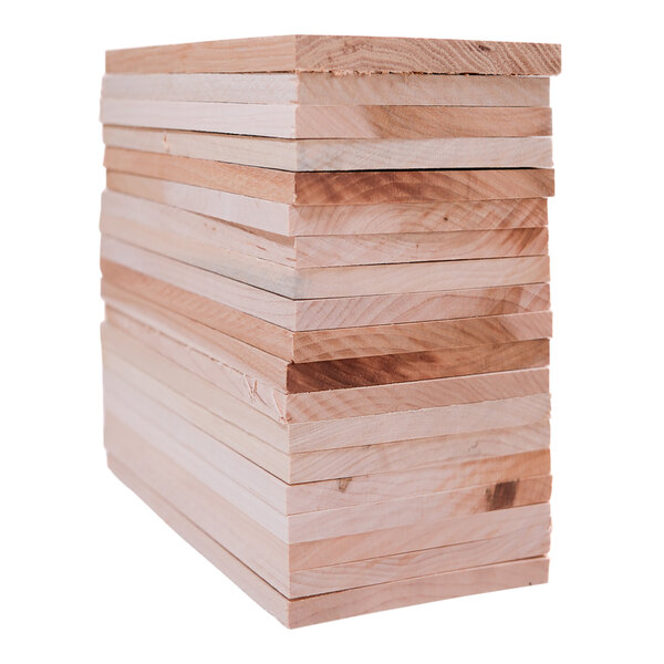 A stack of Wildwood Grilling maple wood planks.