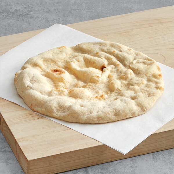 A Rich's Pinsa flatbread on a cutting board.